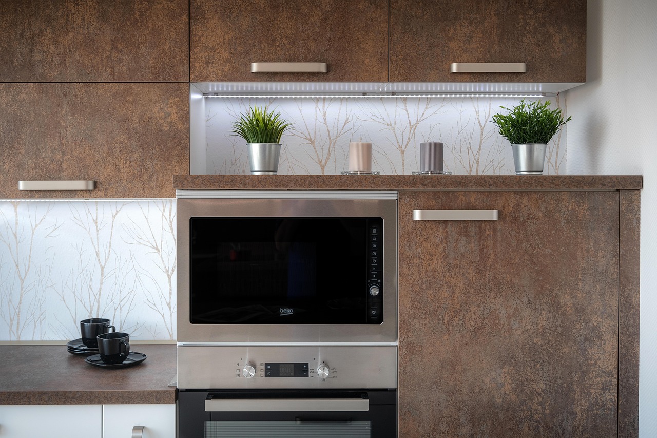 Granite countertop running along a kitchen with a gas cooktop